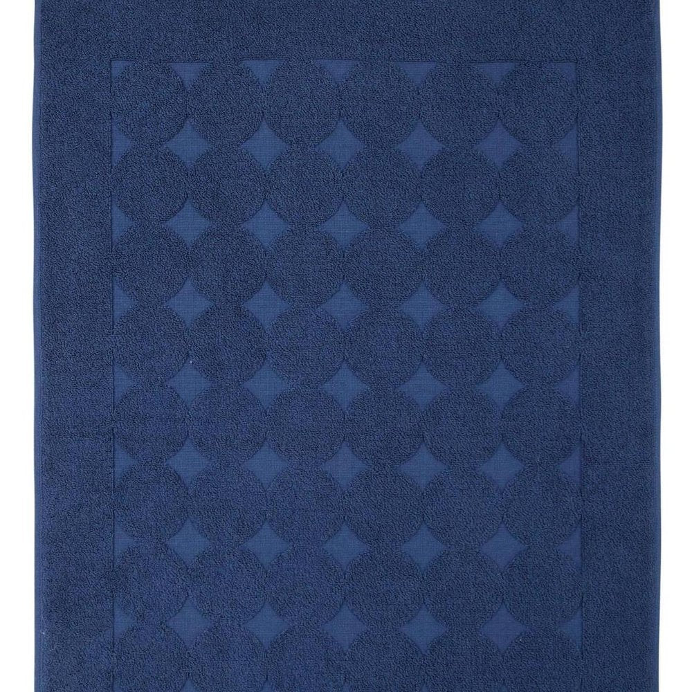 Close-up of 24" X 35" White Tone on Tone Polka Dot Turkish Cotton Bath Rug showing the white cotton texture.