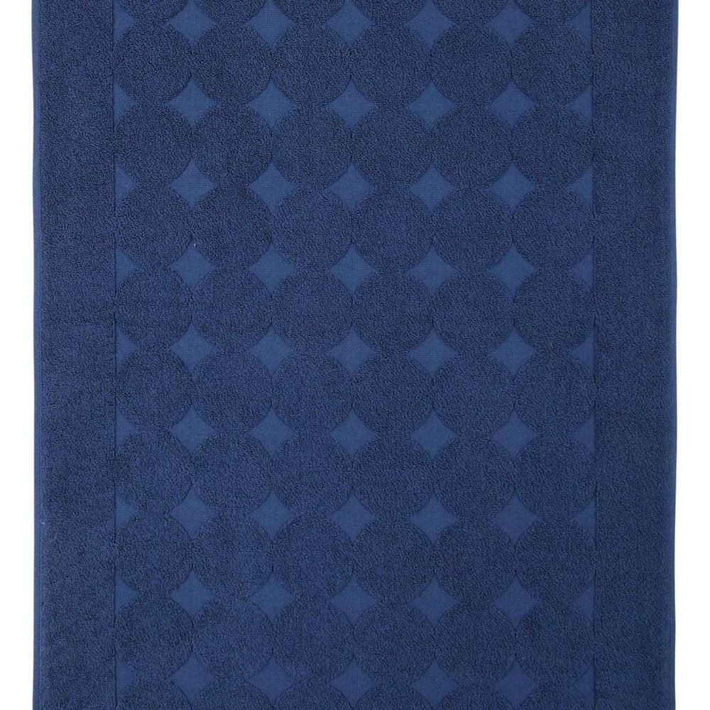 Detail view of 24" X 35" White Tone on Tone Polka Dot Turkish Cotton Bath Rug, filling the frame with the cotton texture.