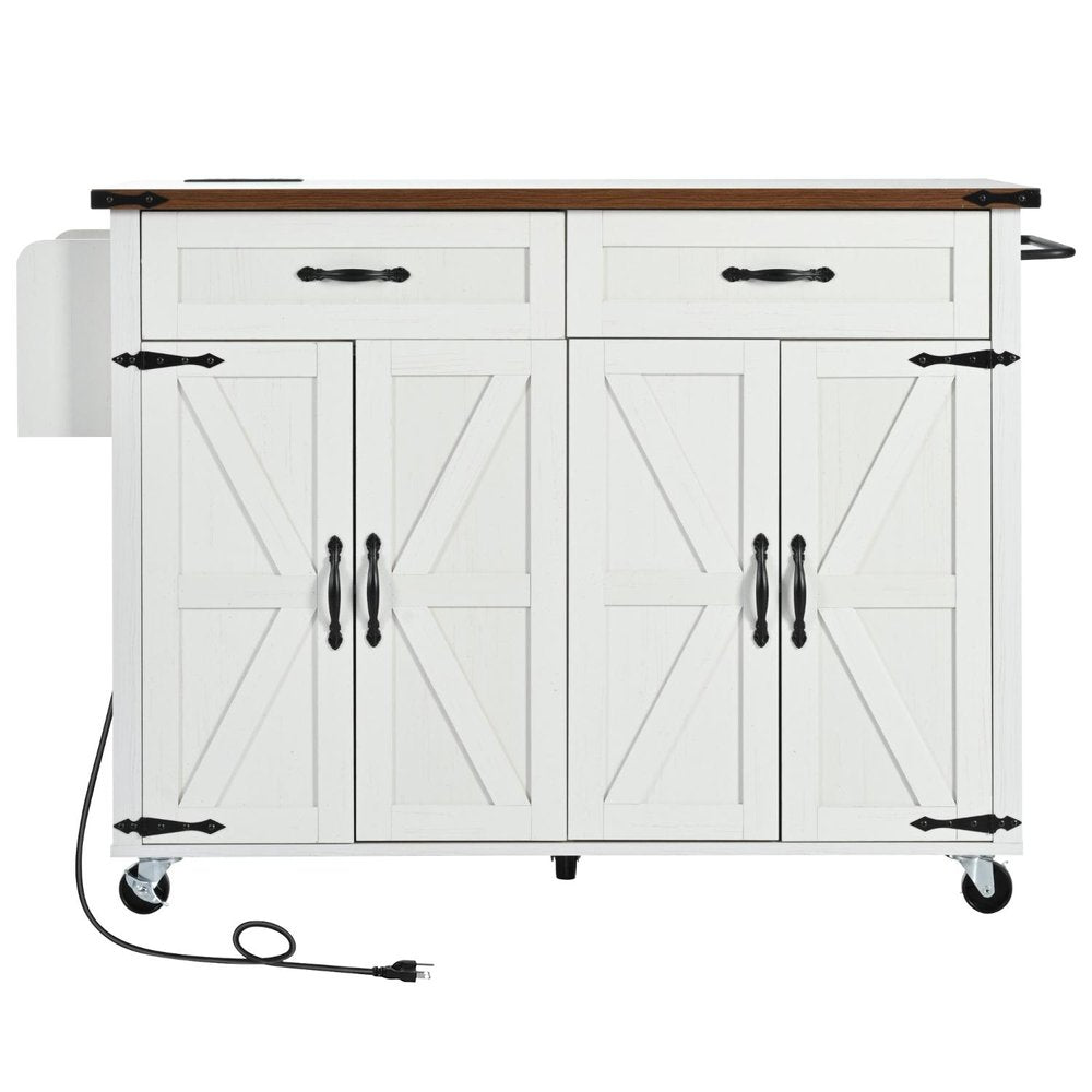 White wood kitchen cart with brown wood top, barn doors, drawers, and black hardware on wheels.