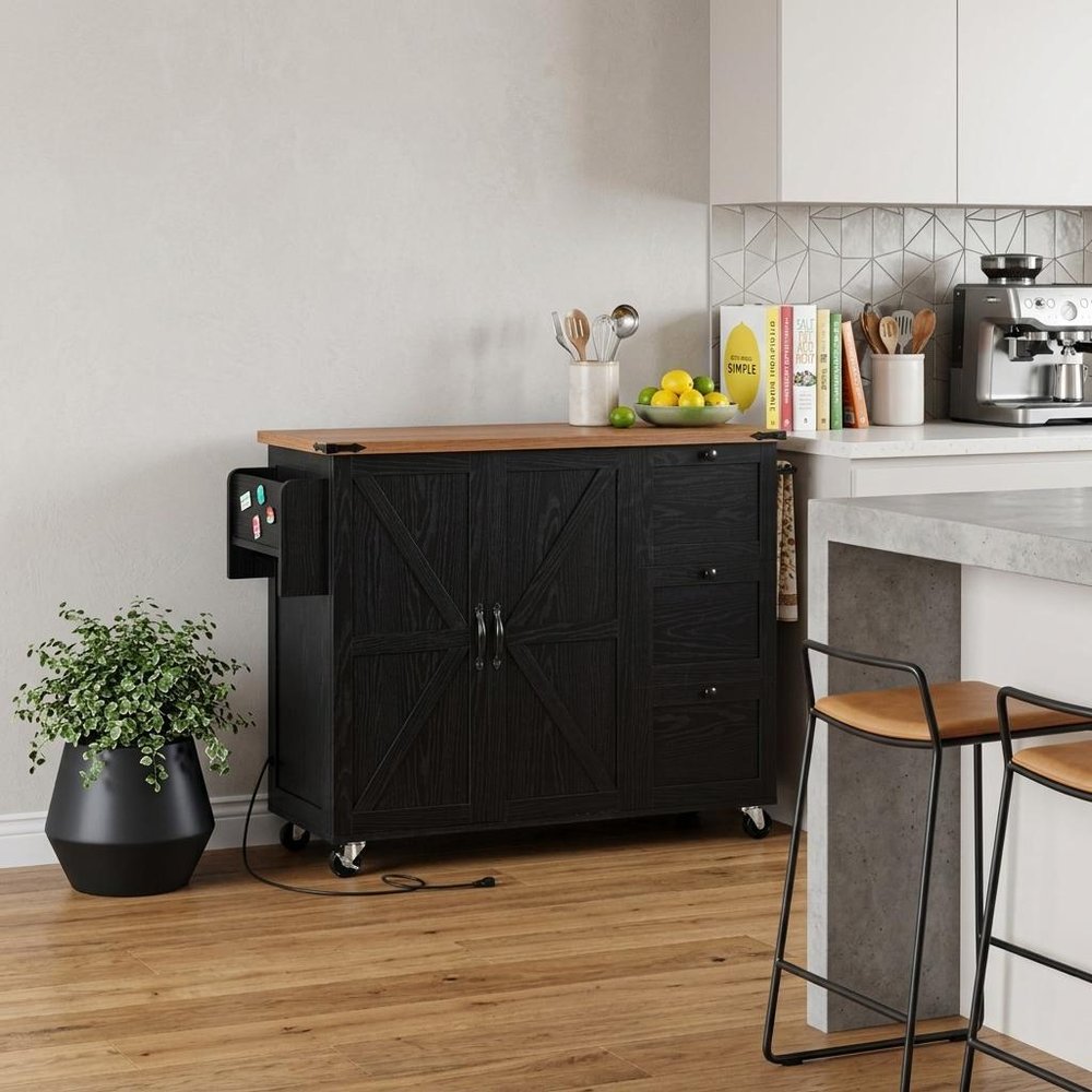 55" Brown and Black Wood Flat Door Rolling Kitchen Cart With Storage With USB styled in a furnished interior with a light gray wall on a wood floor.