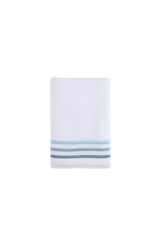 White Turkish cotton bath towel with blue and grey stripes at the hem on a white background.