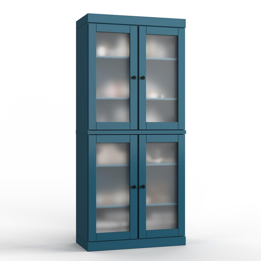 Teal blue solid wood double door linen cabinet with glass panel inlay on a white background.