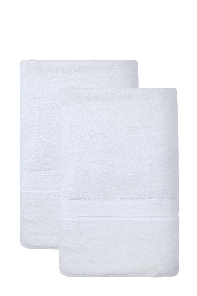 Two white Turkish cotton bath sheets folded and stacked against a white background.