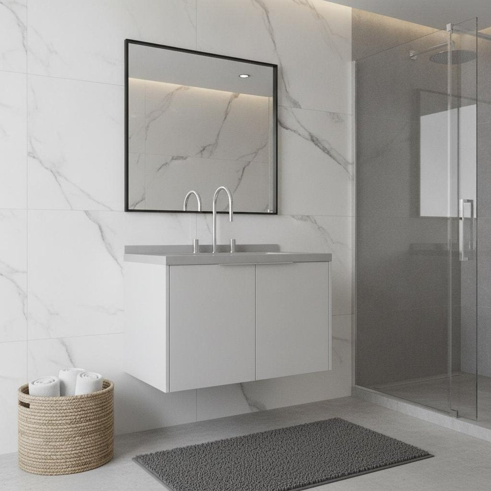 White wood floating double door bathroom vanity with sink and mirror against a marble tiled wall.