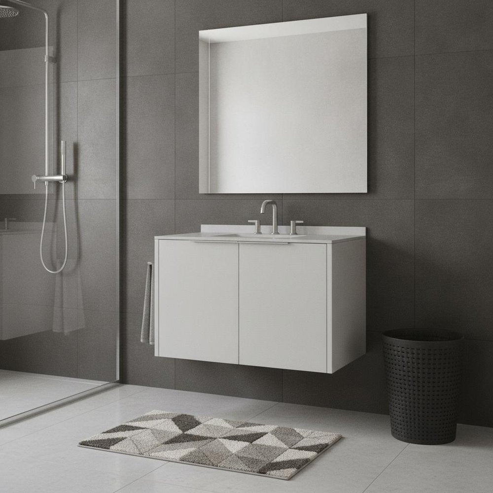 A 36" white wood floating double door bathroom vanity with a sink and mirror against a gray tiled wall.