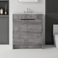 30" Gray Wood Freestanding Double Door Bathroom Vanity With White Sink styled in a furnished interior with a dark wall on a tiled floor.