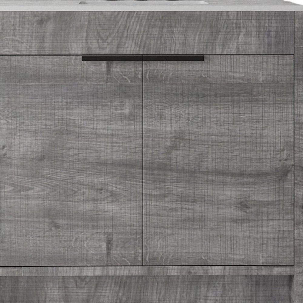 Close-up of 36" Gray Wood Freestanding Double Door Bathroom Vanity With White Sink showing the gray wood texture.