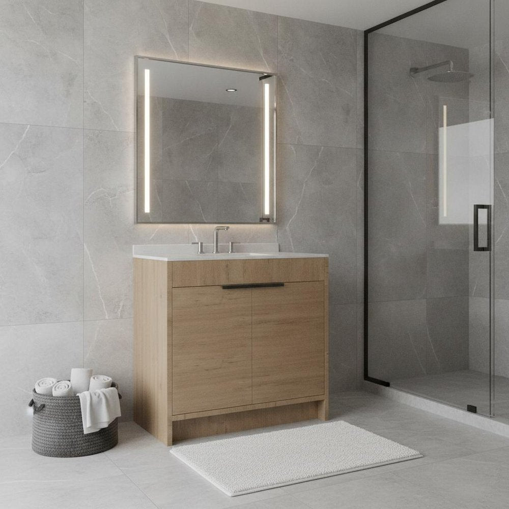 36-inch brown wood freestanding bathroom vanity with white sink and a modern illuminated mirror in a tiled bathroom.