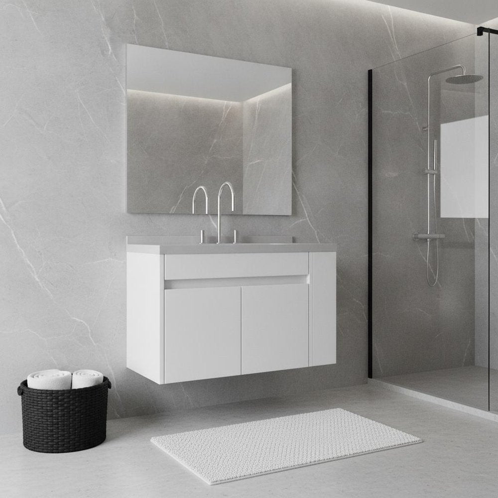 36" white wood floating double door bathroom vanity with sink and mirror on a gray marble wall.