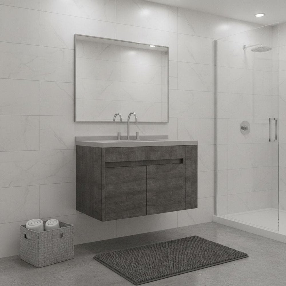 36" gray wood floating double door bathroom vanity with white sink and chrome faucets against a white tiled wall.